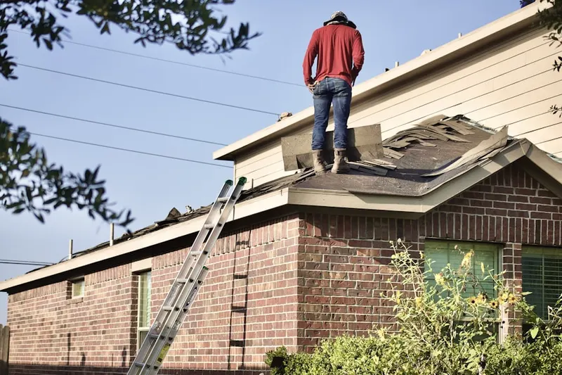 Professional roofer working on a residential roof in Eaglewood
